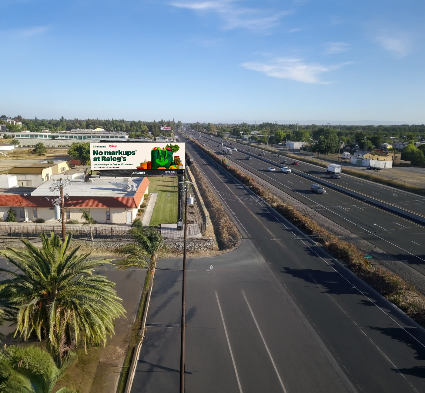 Digital billboard advertising Raley's beside a multilane highway