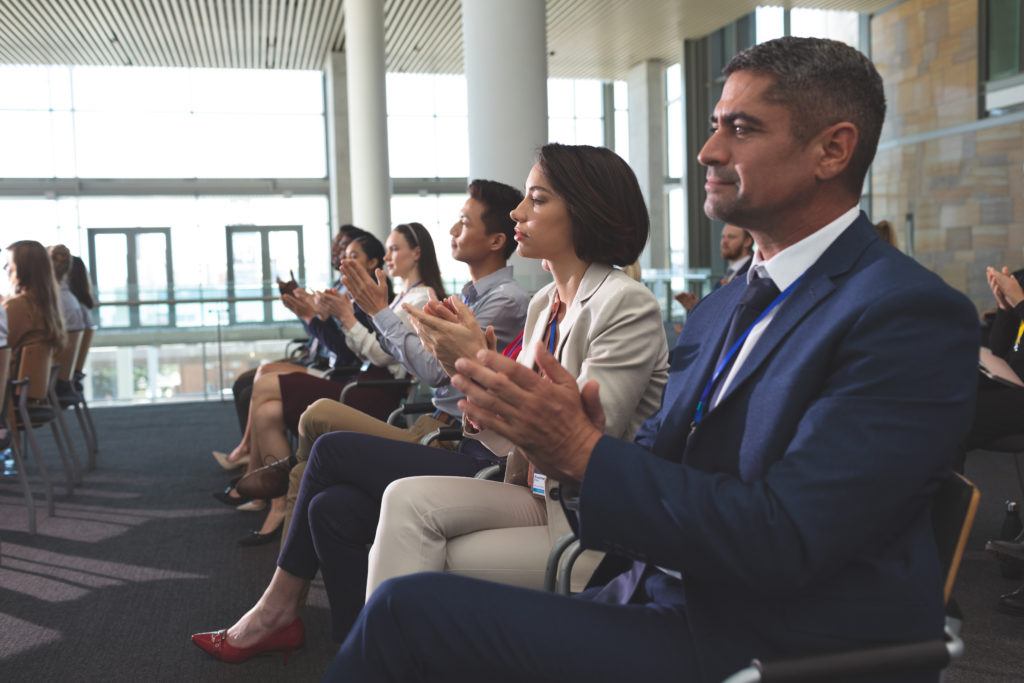 side view of diverse business people clapping