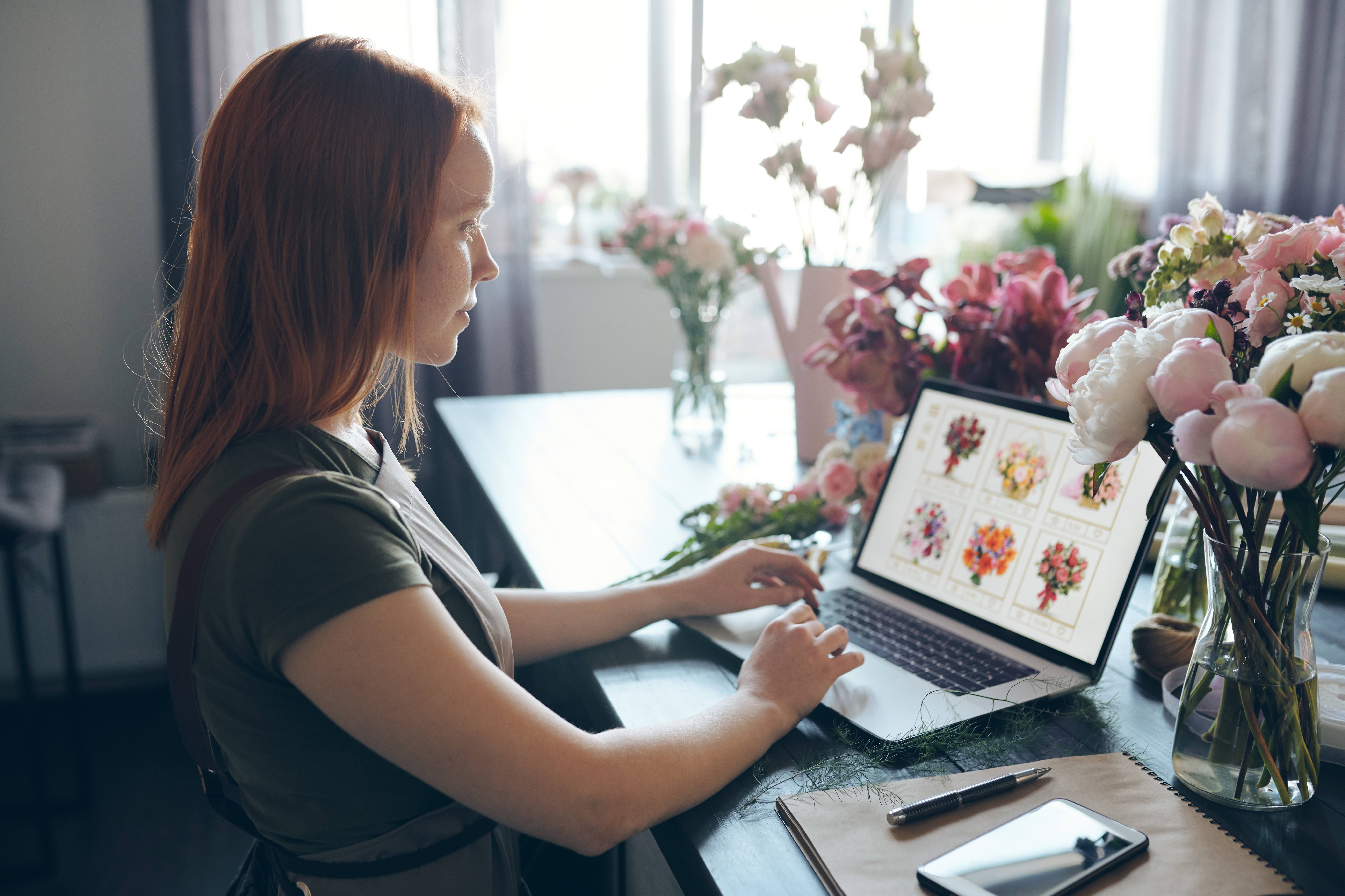 young woman viewing flower website