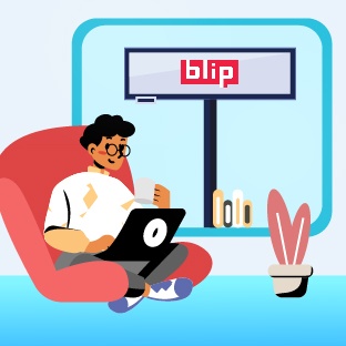 Person on chair using laptop with Blip screen