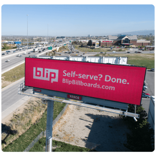 Roadside red “Self-serve? Done.” billboard photo