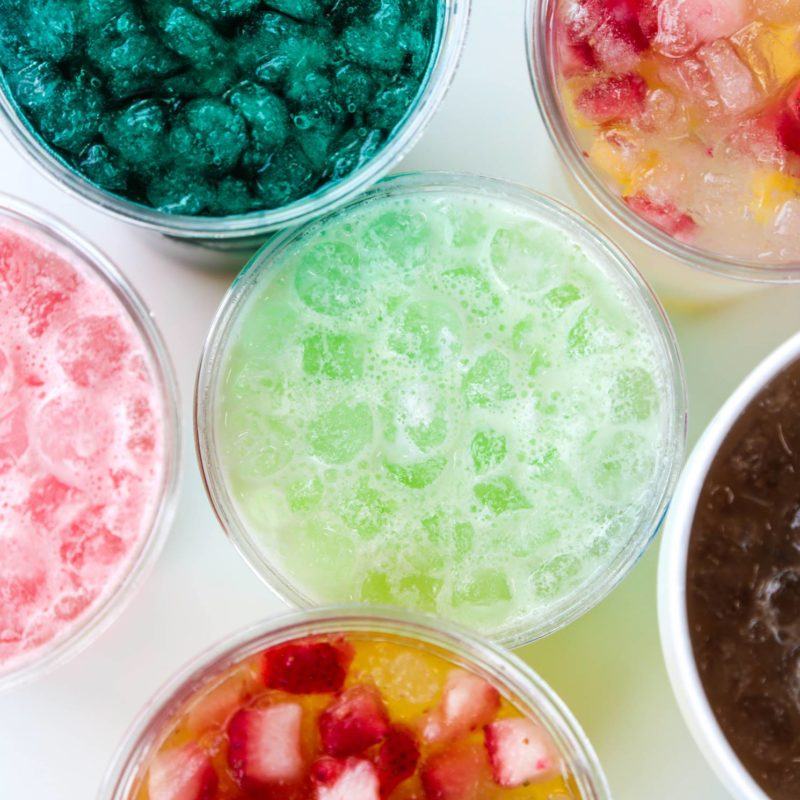 Overhead bowls of colorful desserts