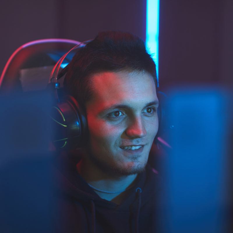 excited gamer watching computer monitor