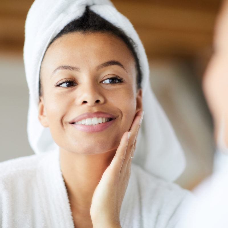 Spa woman smiling in white towel and robe
