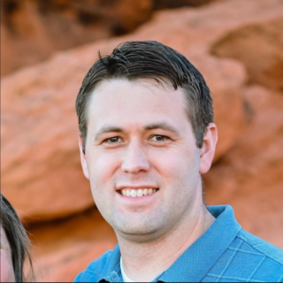 Portrait of smiling man outdoors, shallow depth of field