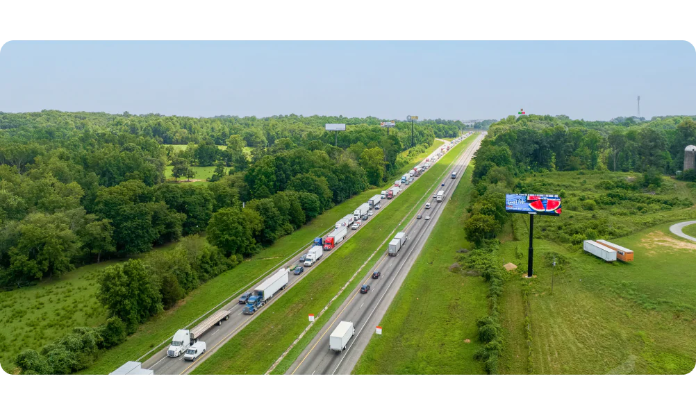 Digital billboard above highway traffic
