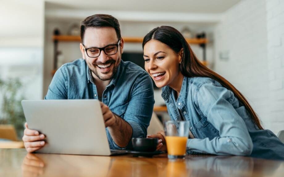 Two people on the computer using Blip's billboard referral program