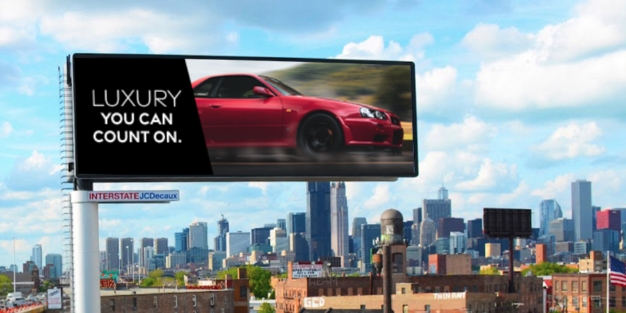 Luxury car featured on billboards in the city.